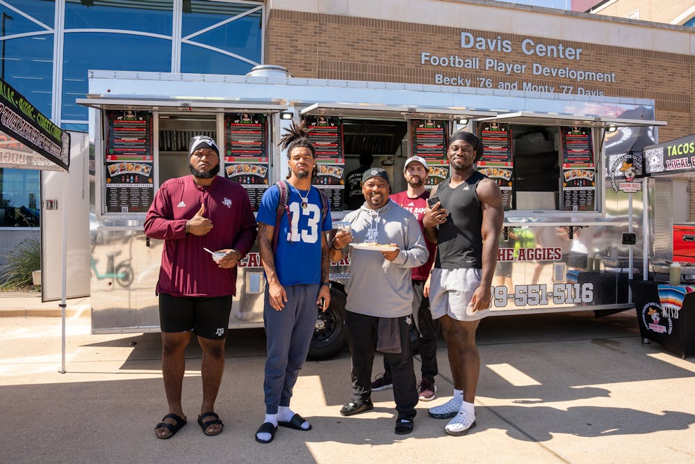 a group of people standing in front of a building