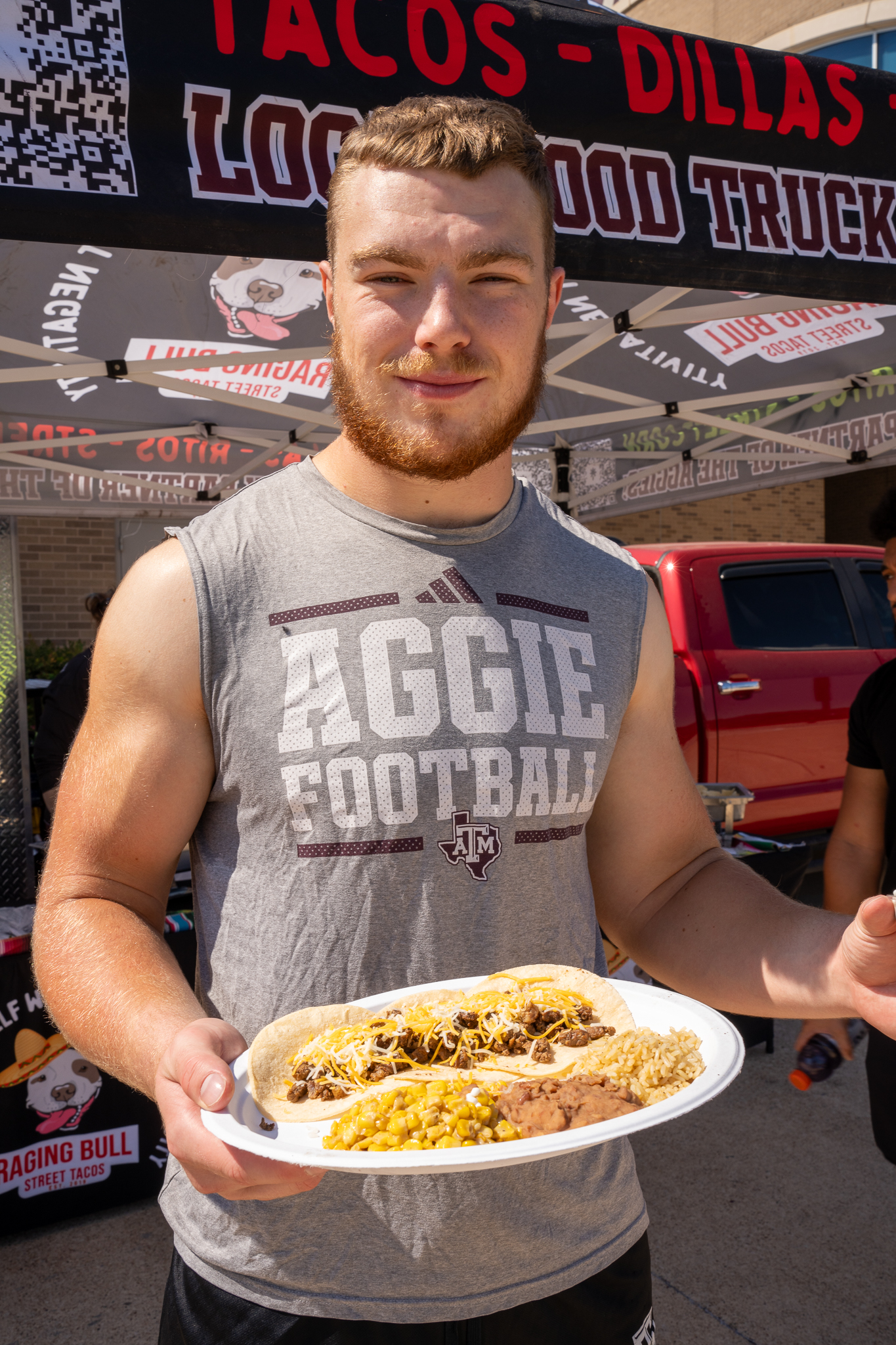 a man holding a plate of food