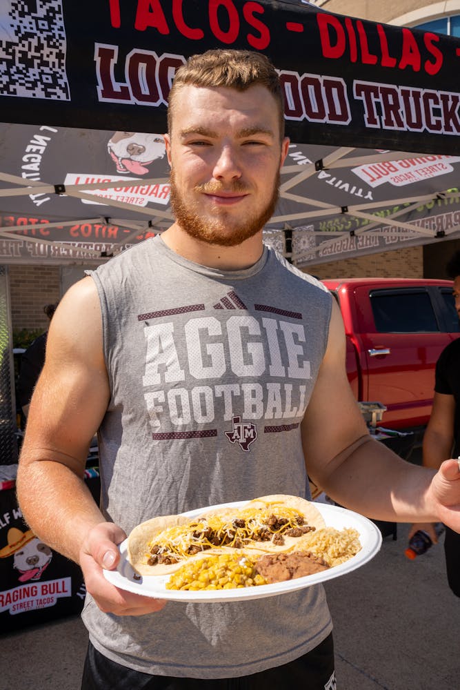a man holding a plate of food