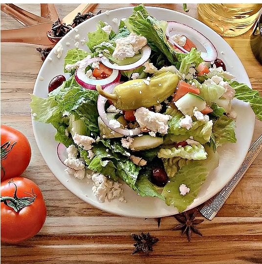 a plate of food with a sandwich and a salad