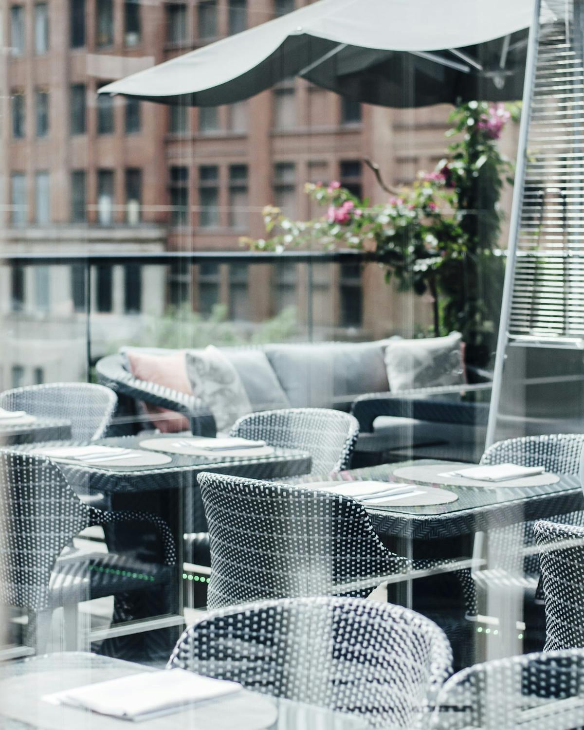 an outdoor balcony dining area