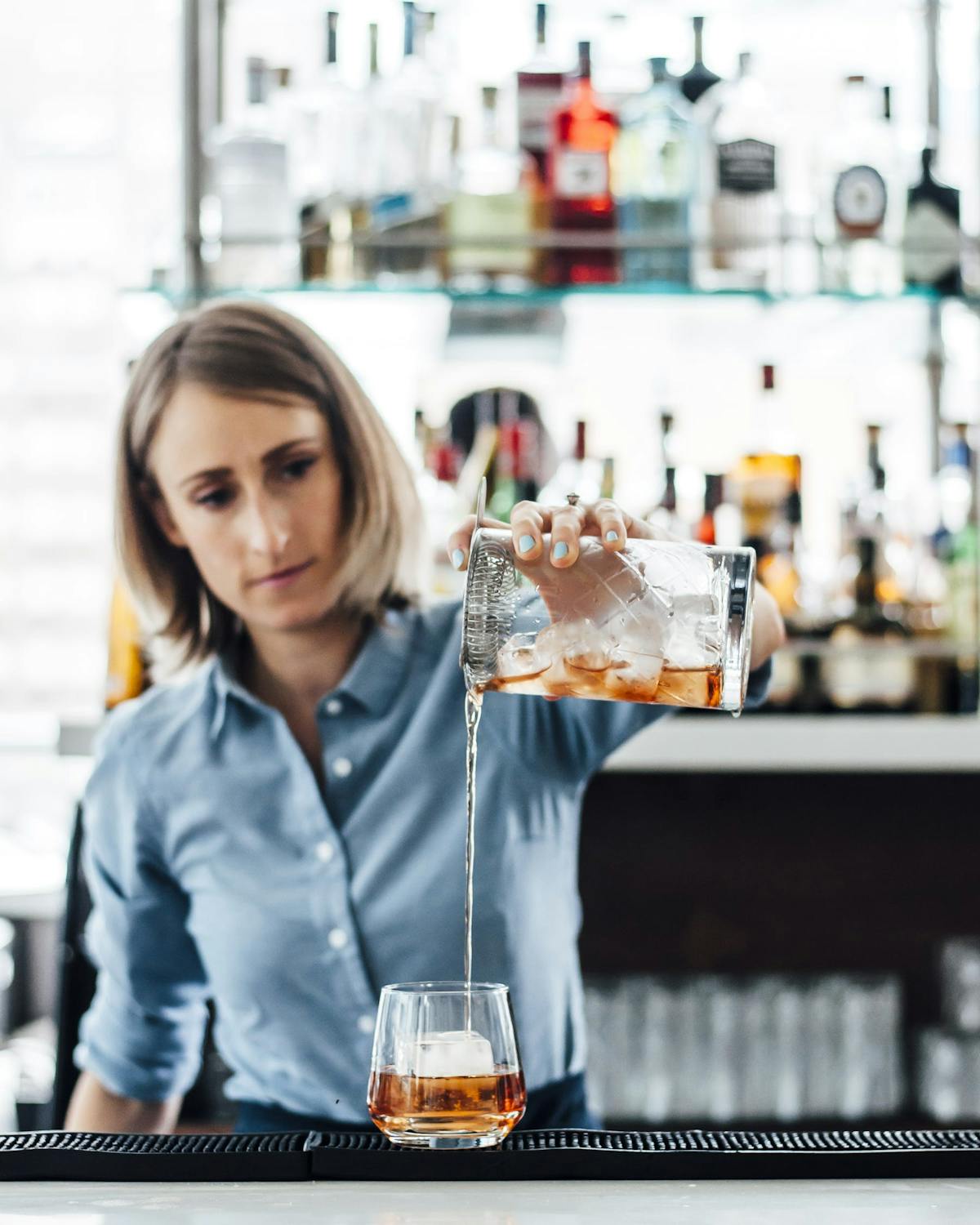 a bartender serving a drink