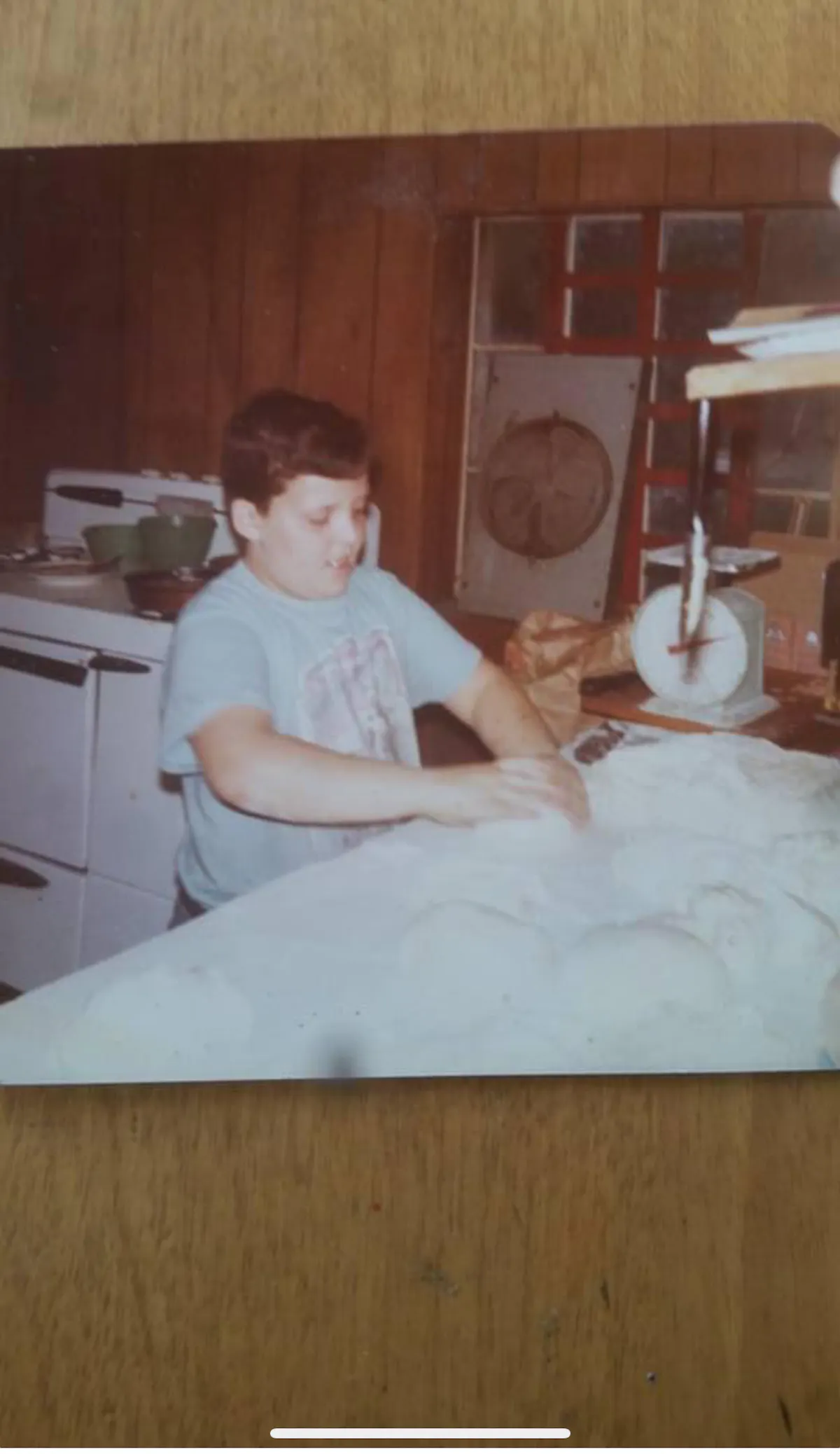 a person sitting on a kitchen counter