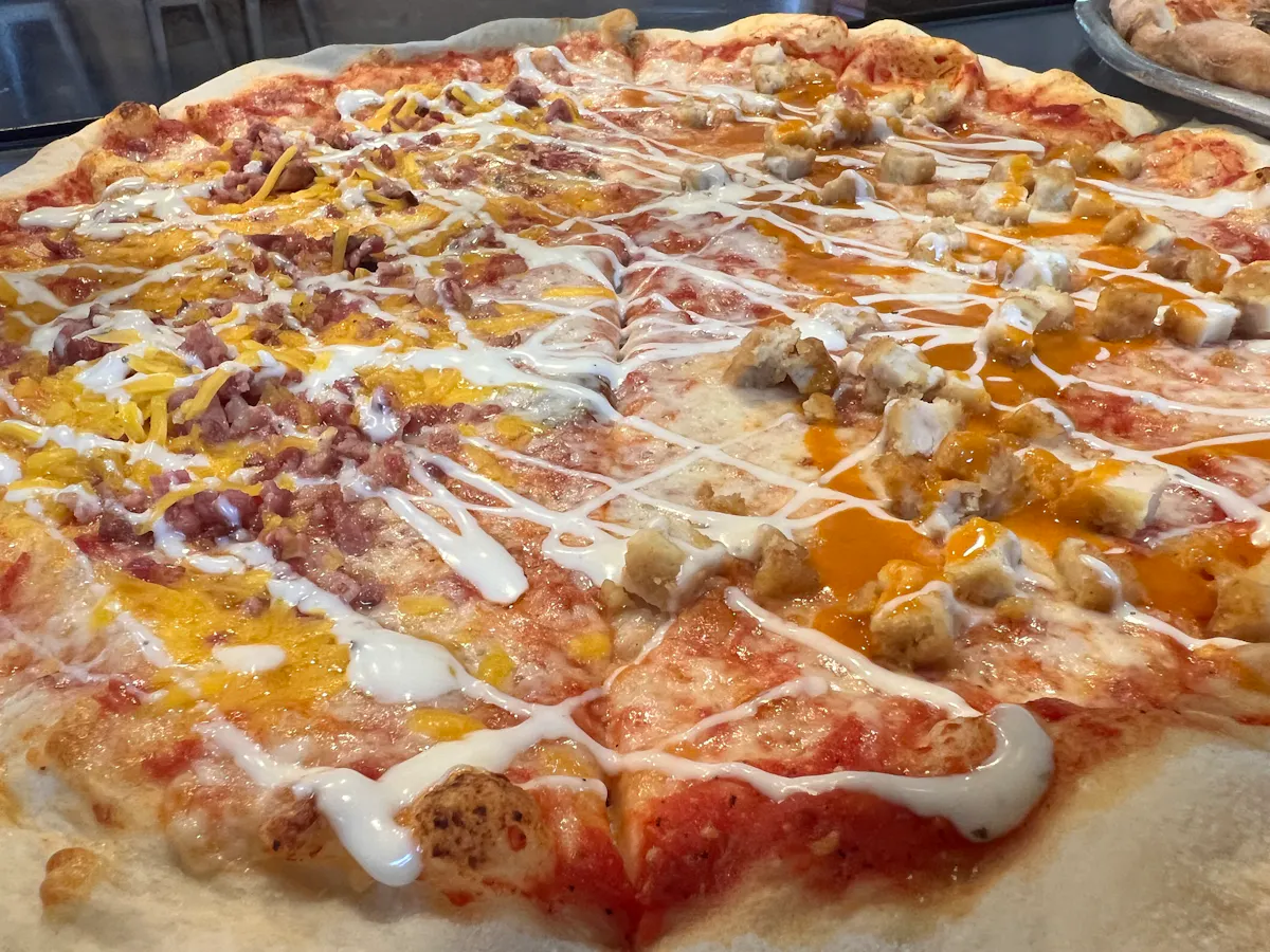 a close up of a slice of pizza