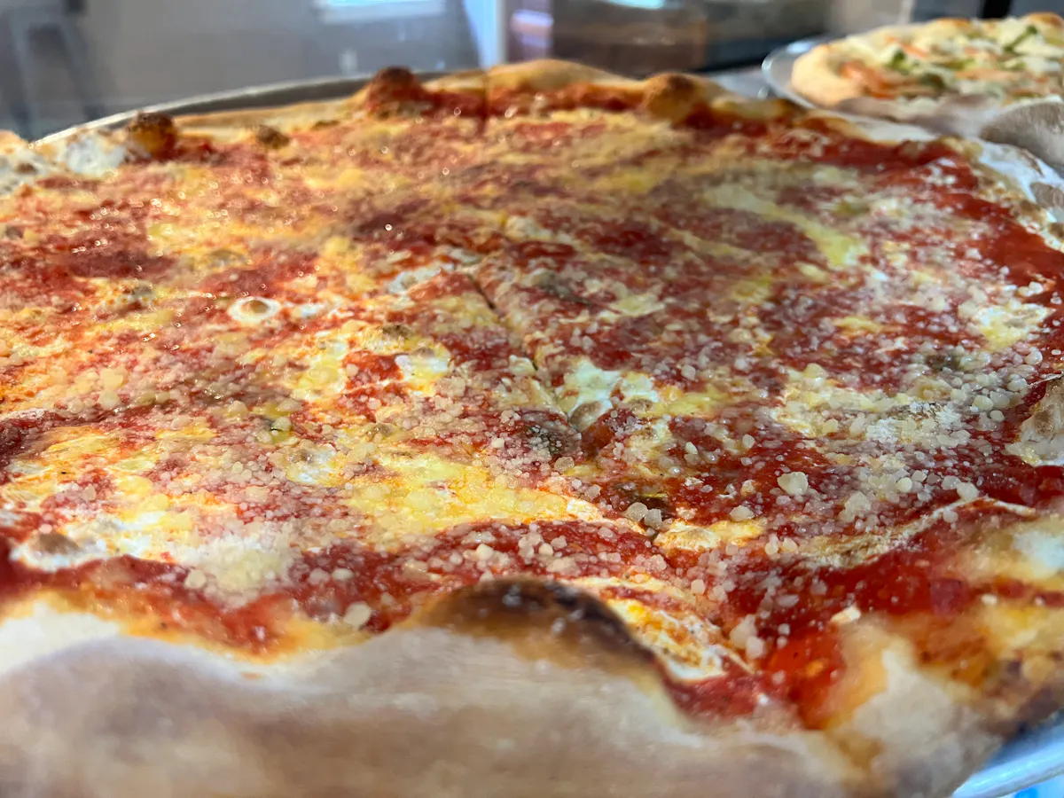a close up of a slice of pizza