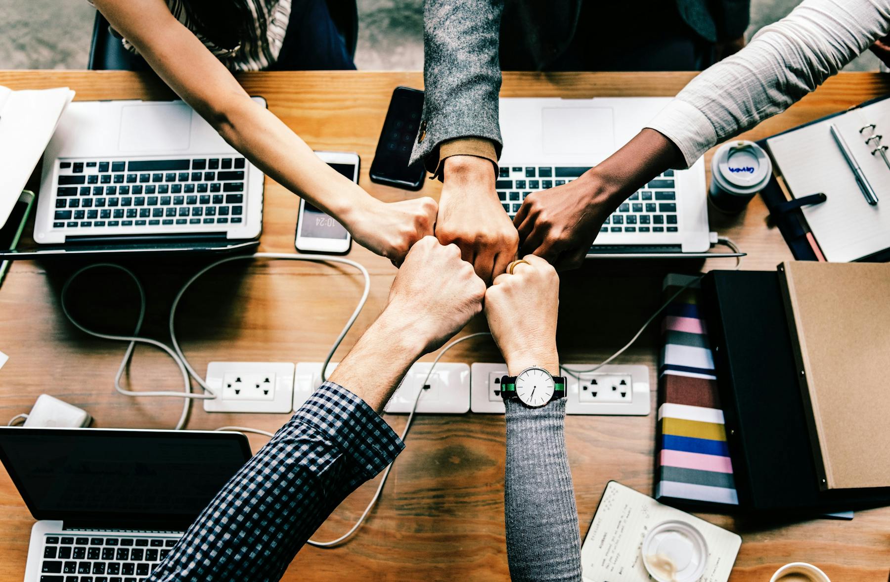 people putting their hands together