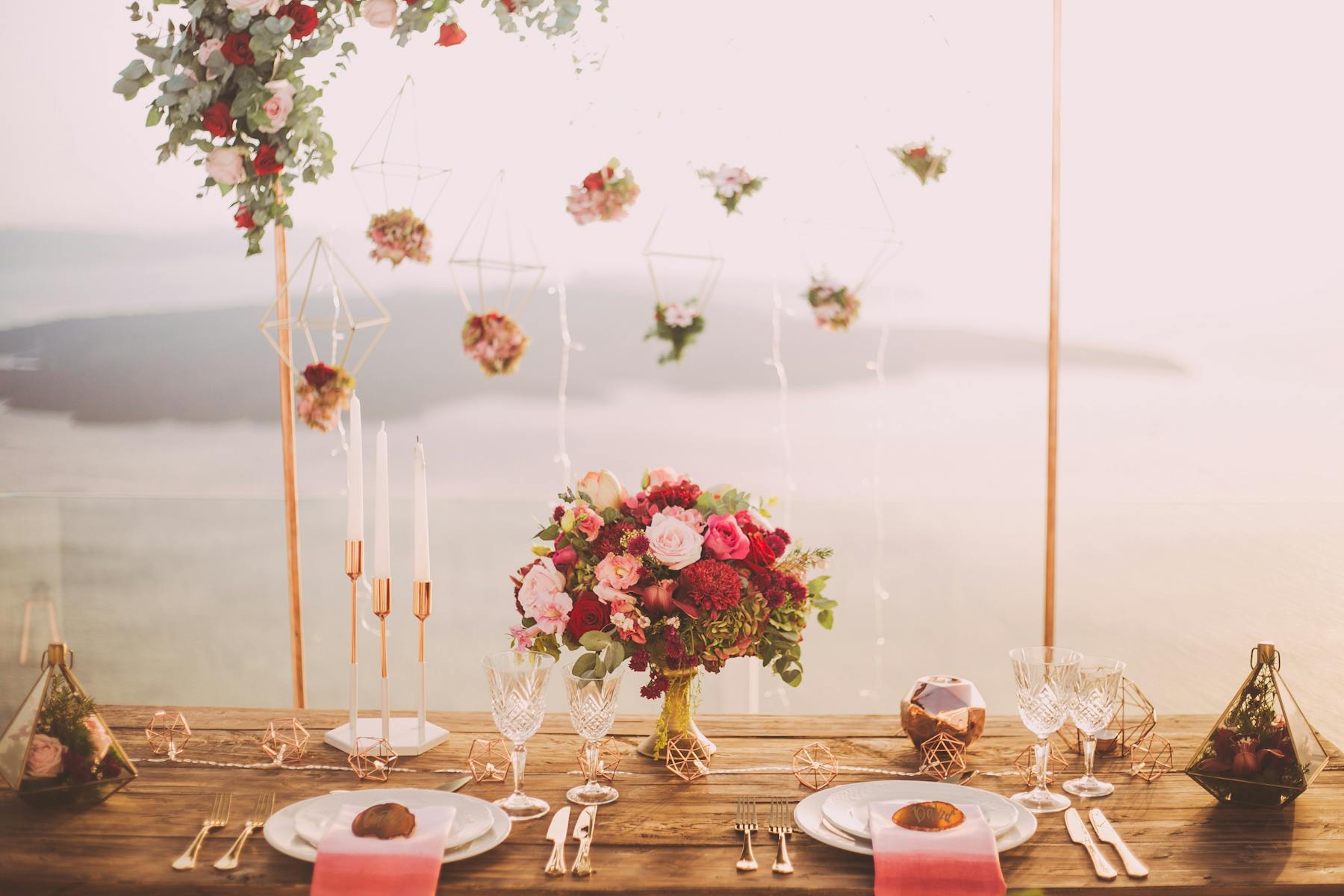 a row of wine glasses on a table