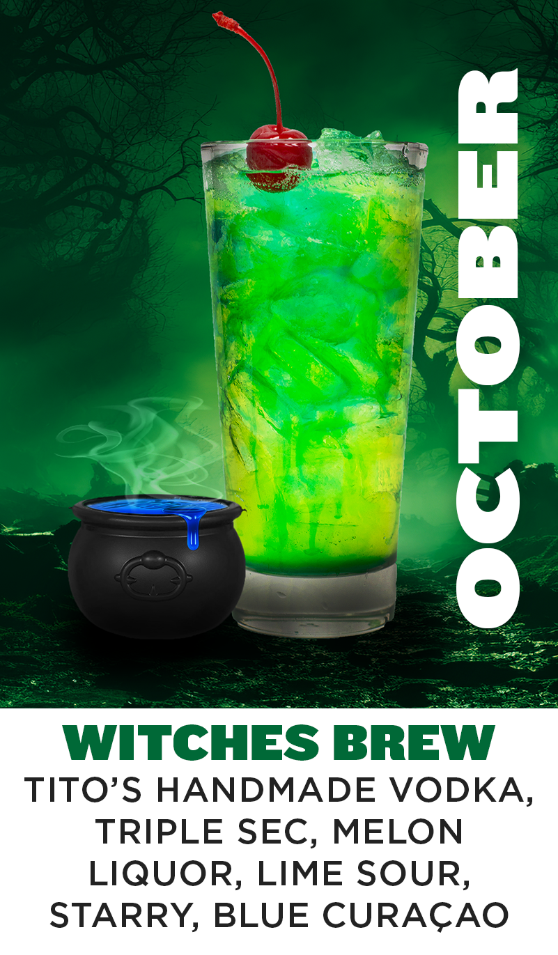 a green drink with a black pot