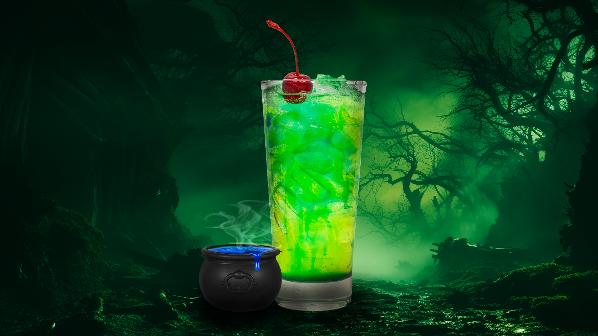 a green drink with a cherry and a black cauldron
