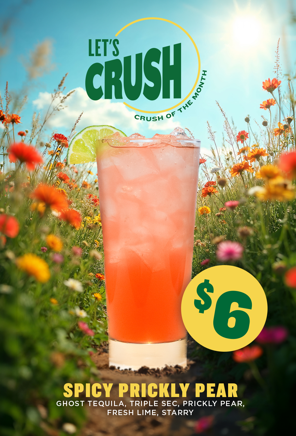 a glass of drink in a field of flowers