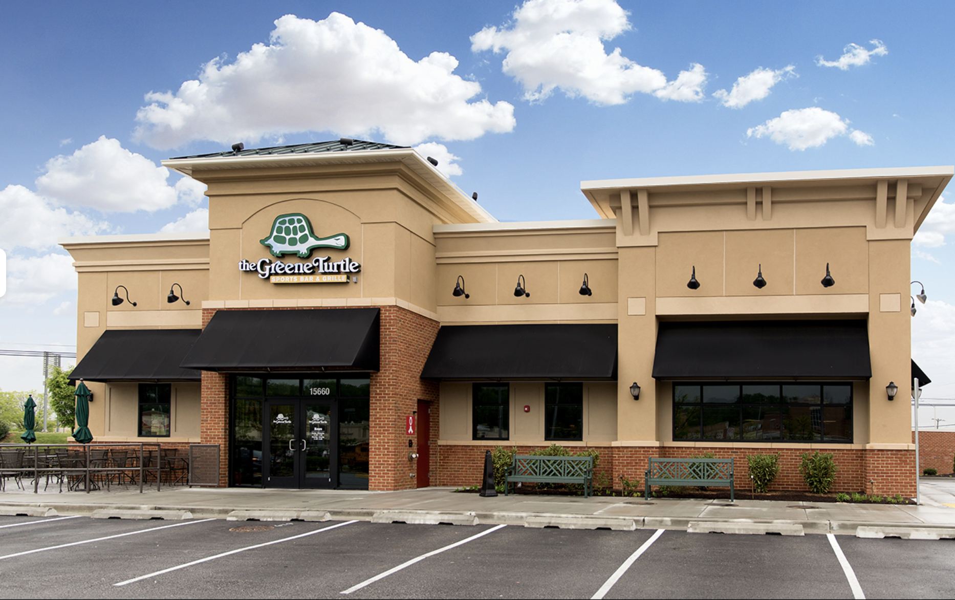 an empty parking lot in front of a building