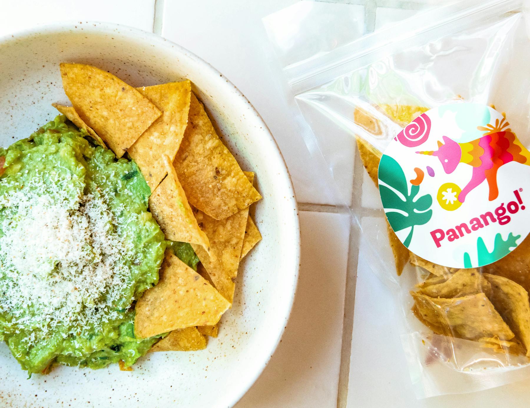 a plate of nachos and guacamole