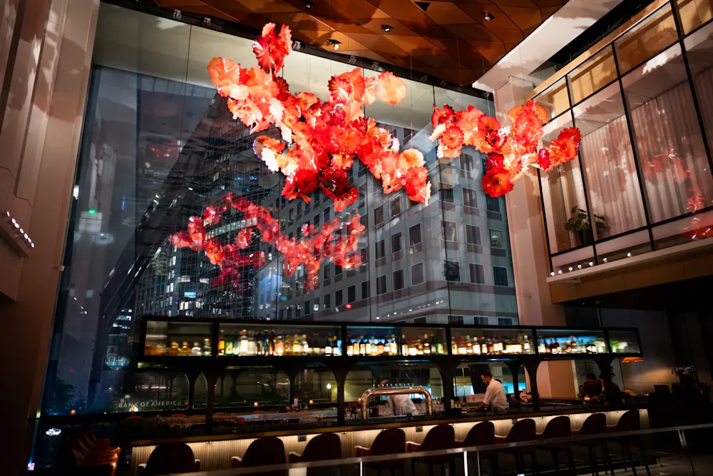 a restaurant with a glass wall and a large window
