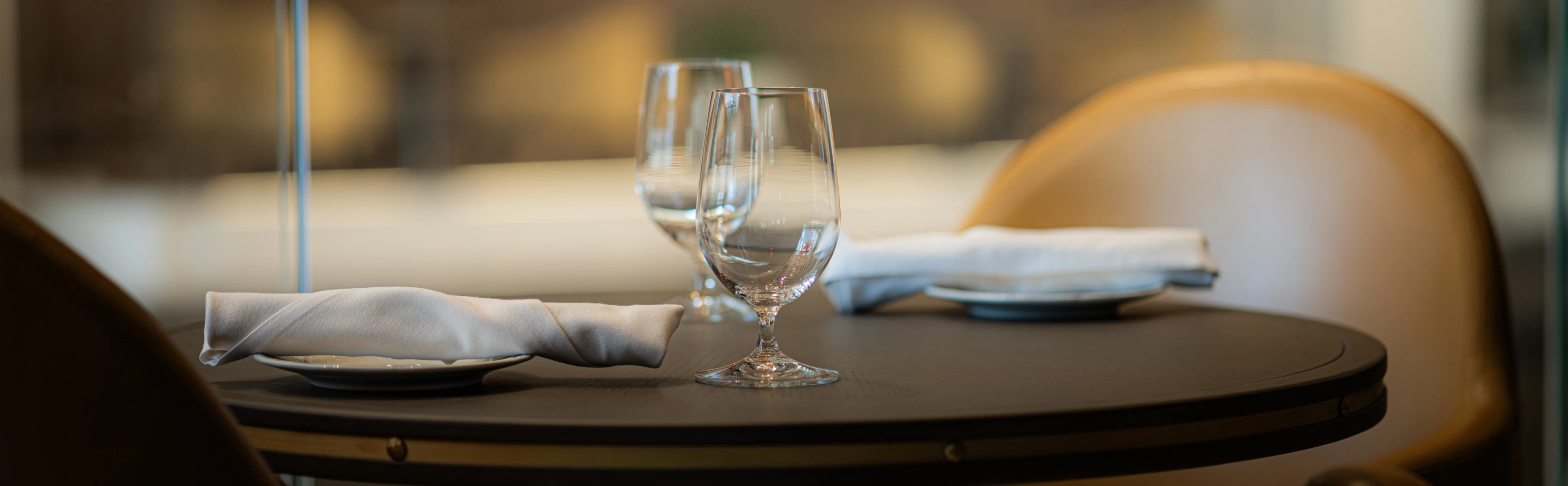 Table set with glasses and napkins at The Vermilion Club