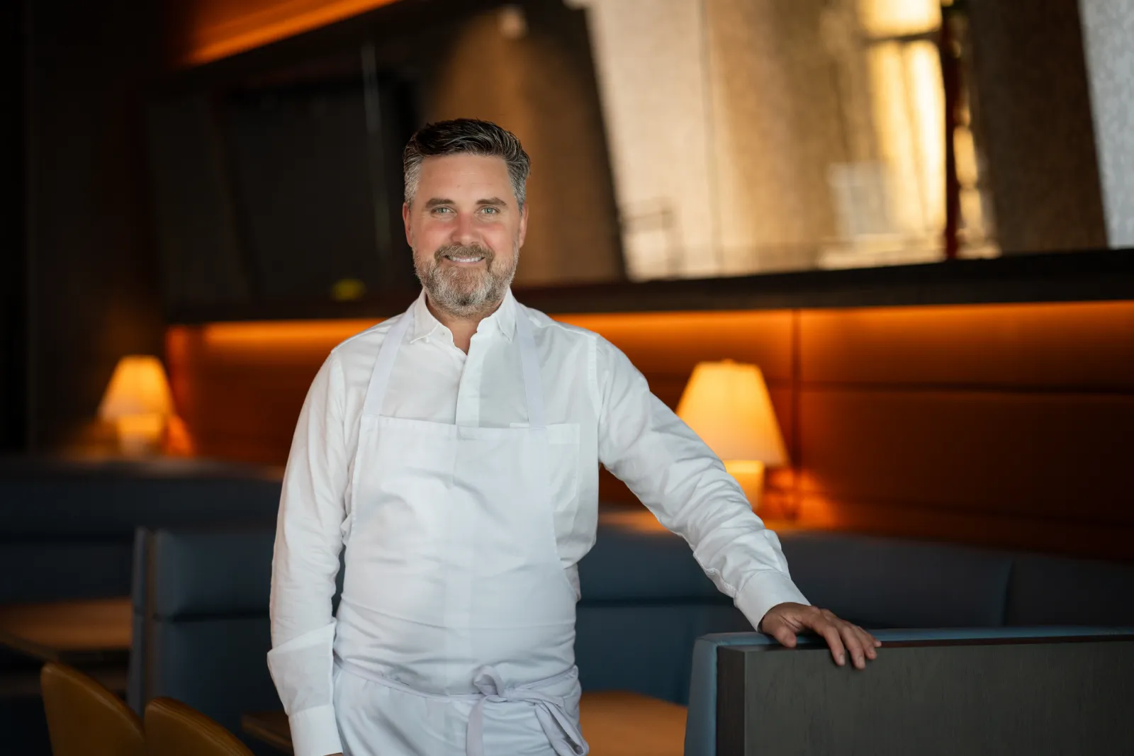 a man in a white apron