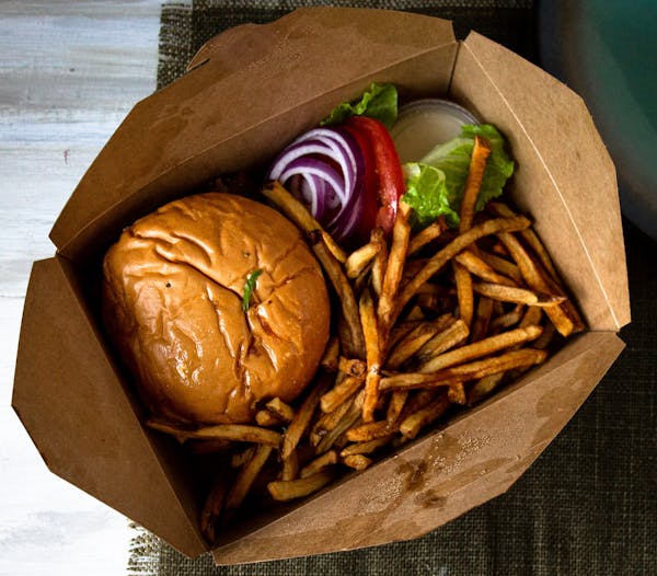a sandwich sitting on top of a wooden table
