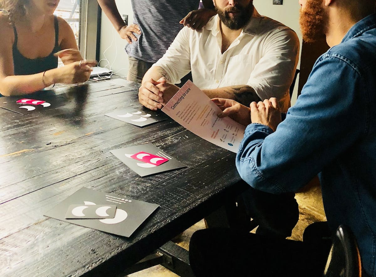 a group of people sitting at a table