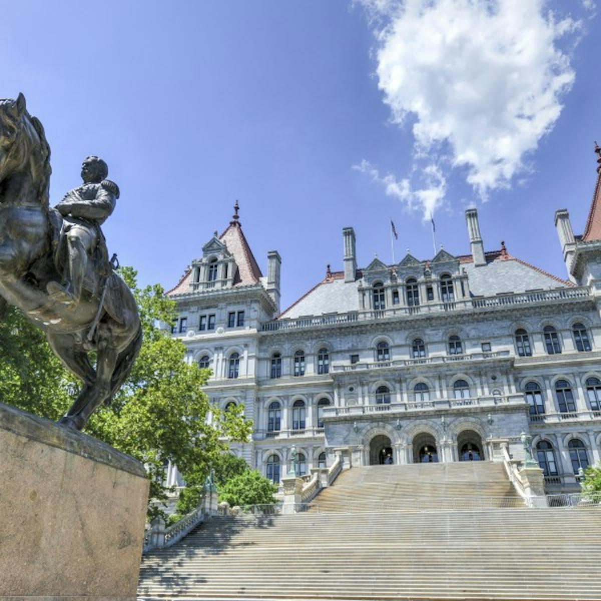 a statue in front of a building