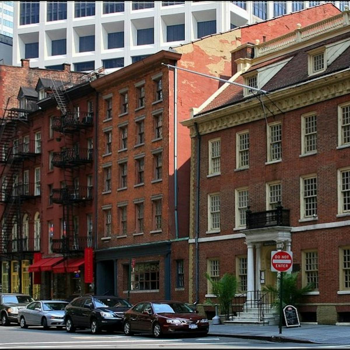 a city street in front of a brick building