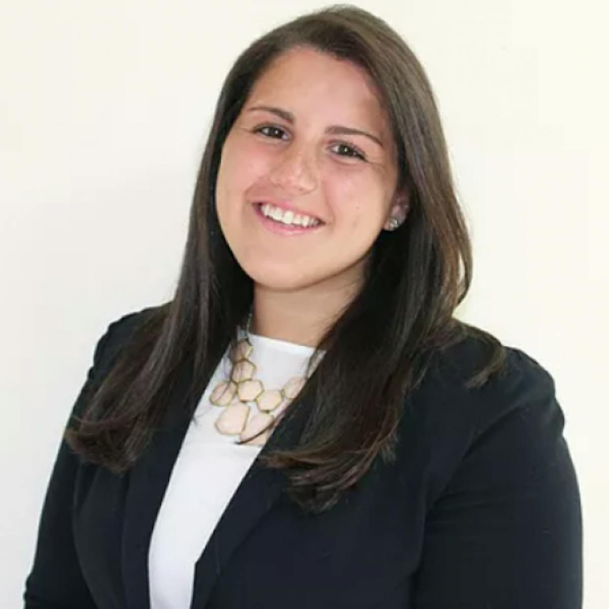 a woman smiling and posing for the camera