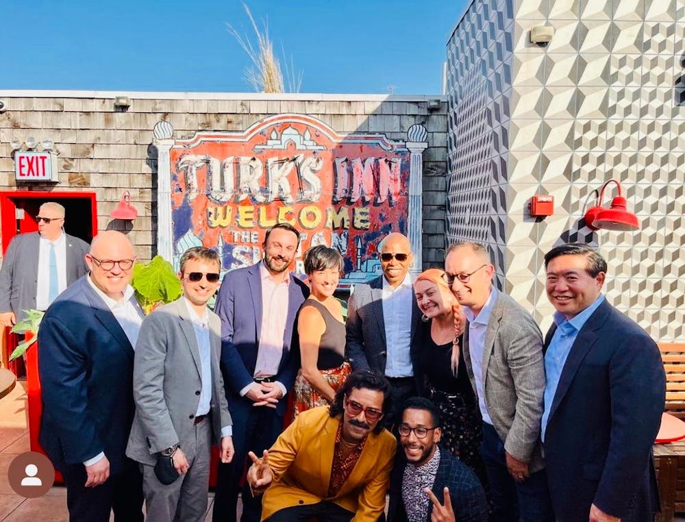 a group of people standing in front of a building