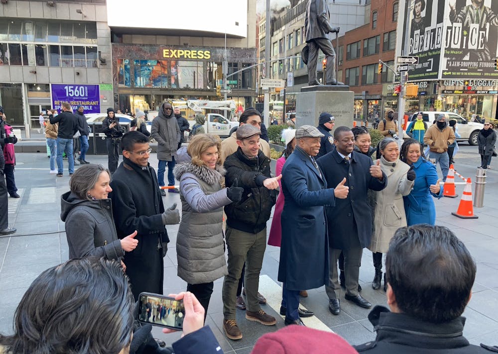 Eric Adams, Brian Benjamin on a city street