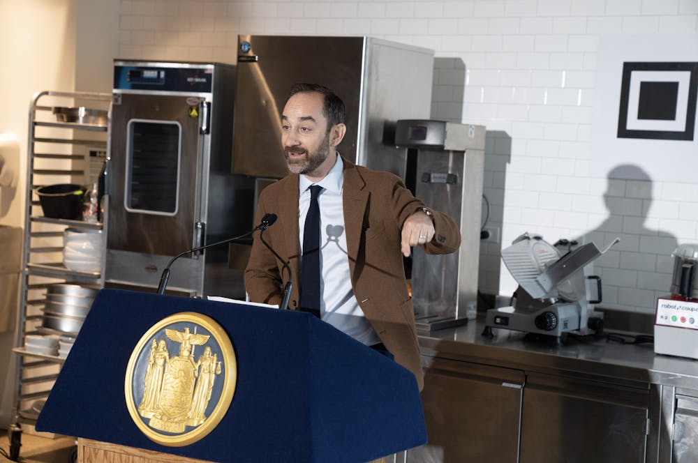 a man standing in front of a computer