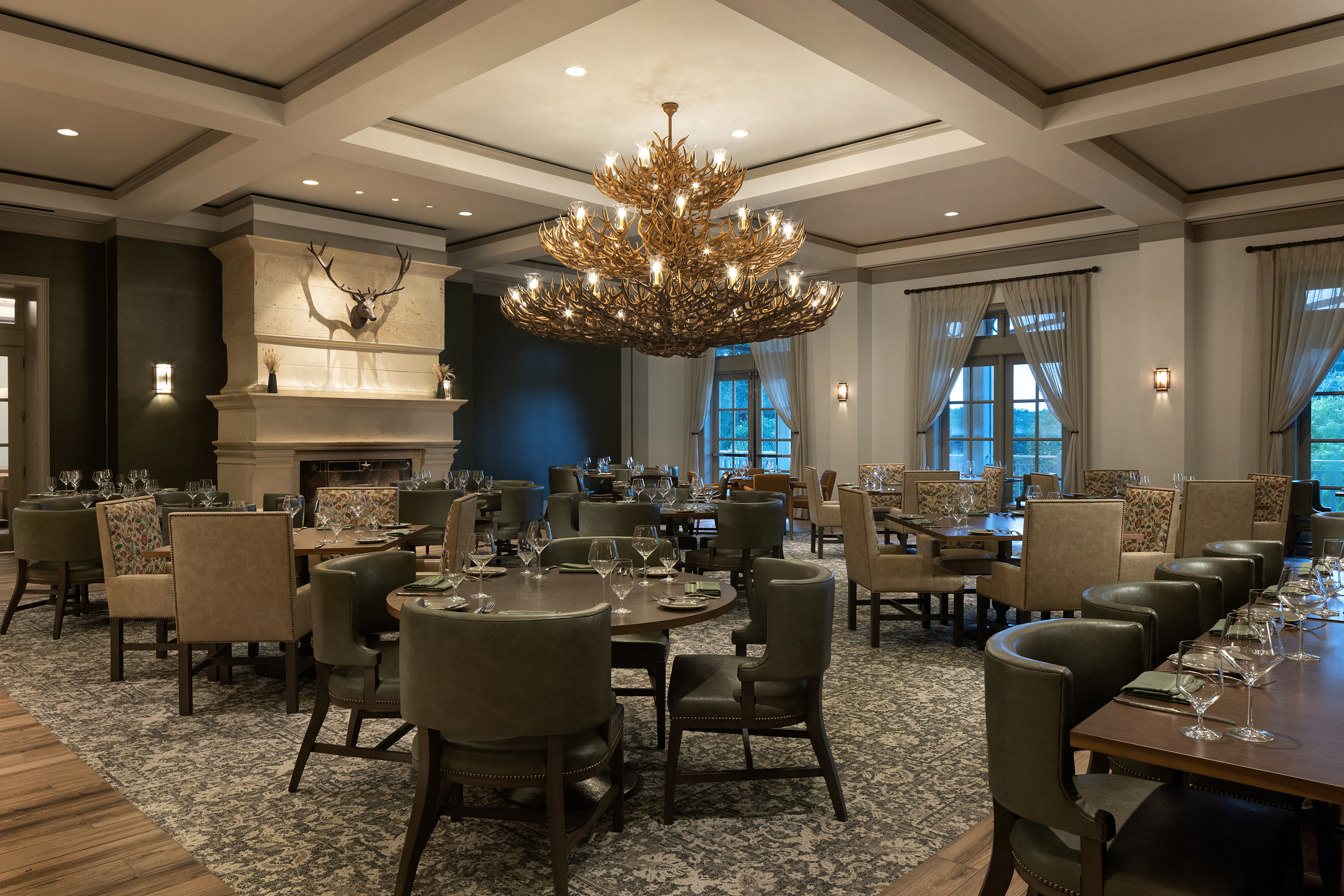 a living room filled with furniture and a large window