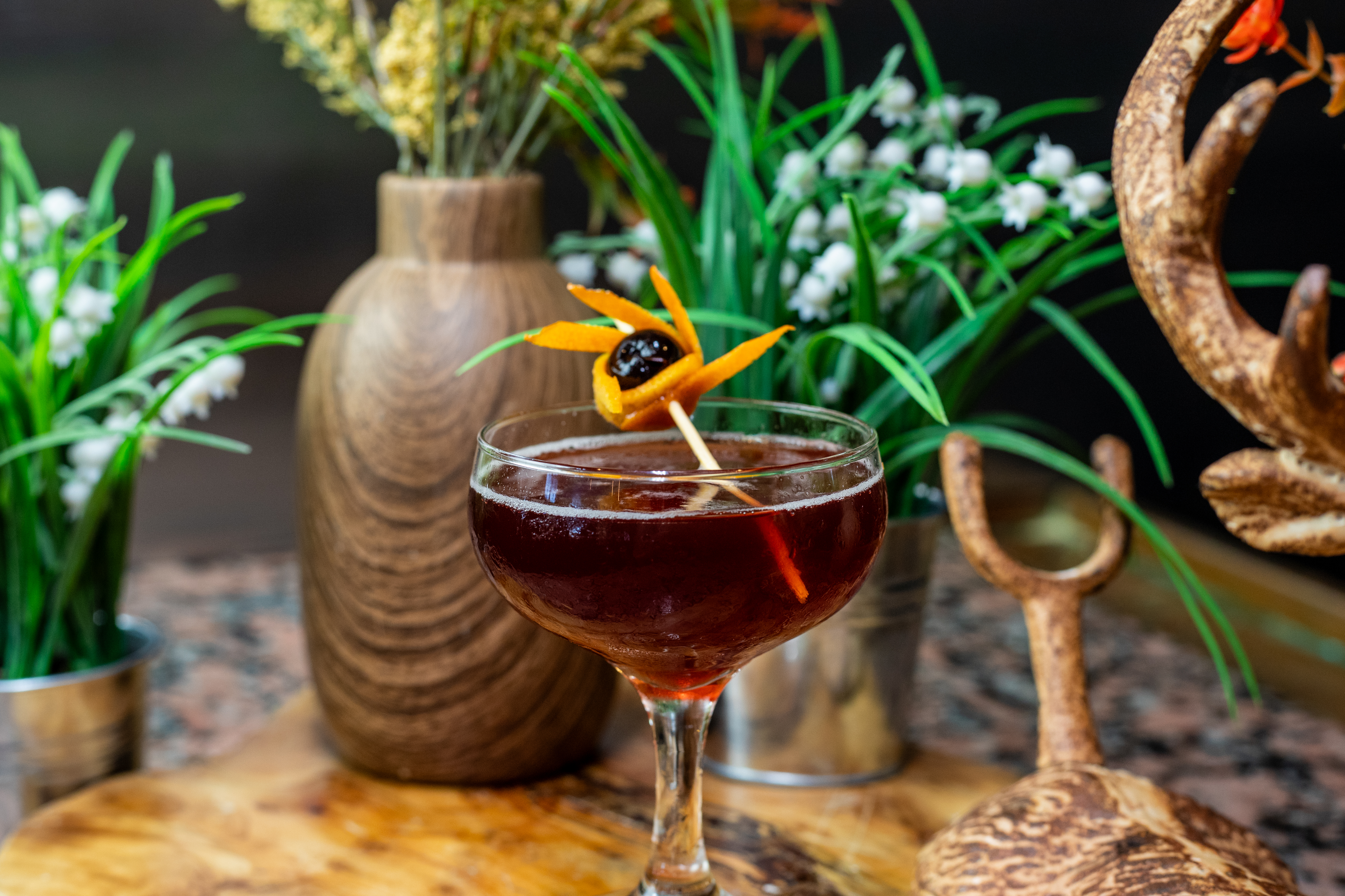 a close up of a wine glass on a table
