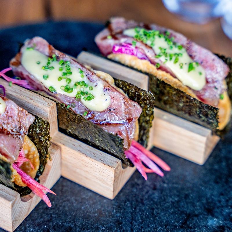 a close up of a slice of birthday cake on a table