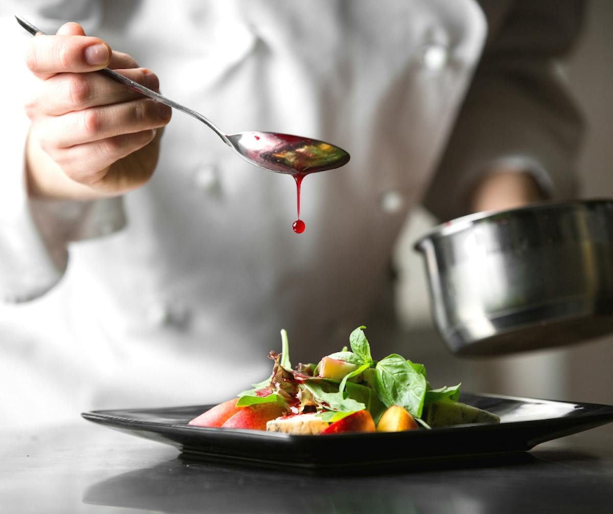 a person holding a bowl of food