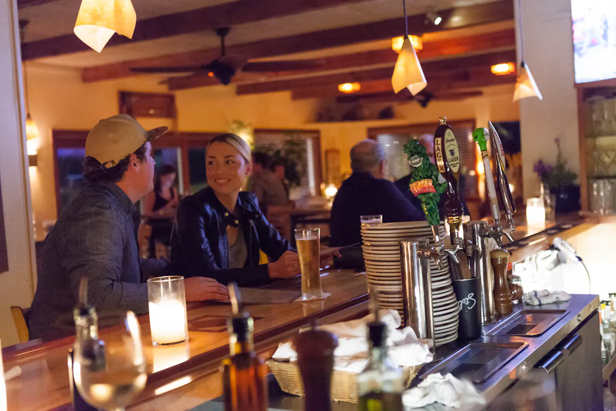 a group of people sitting at a table in a restaurant