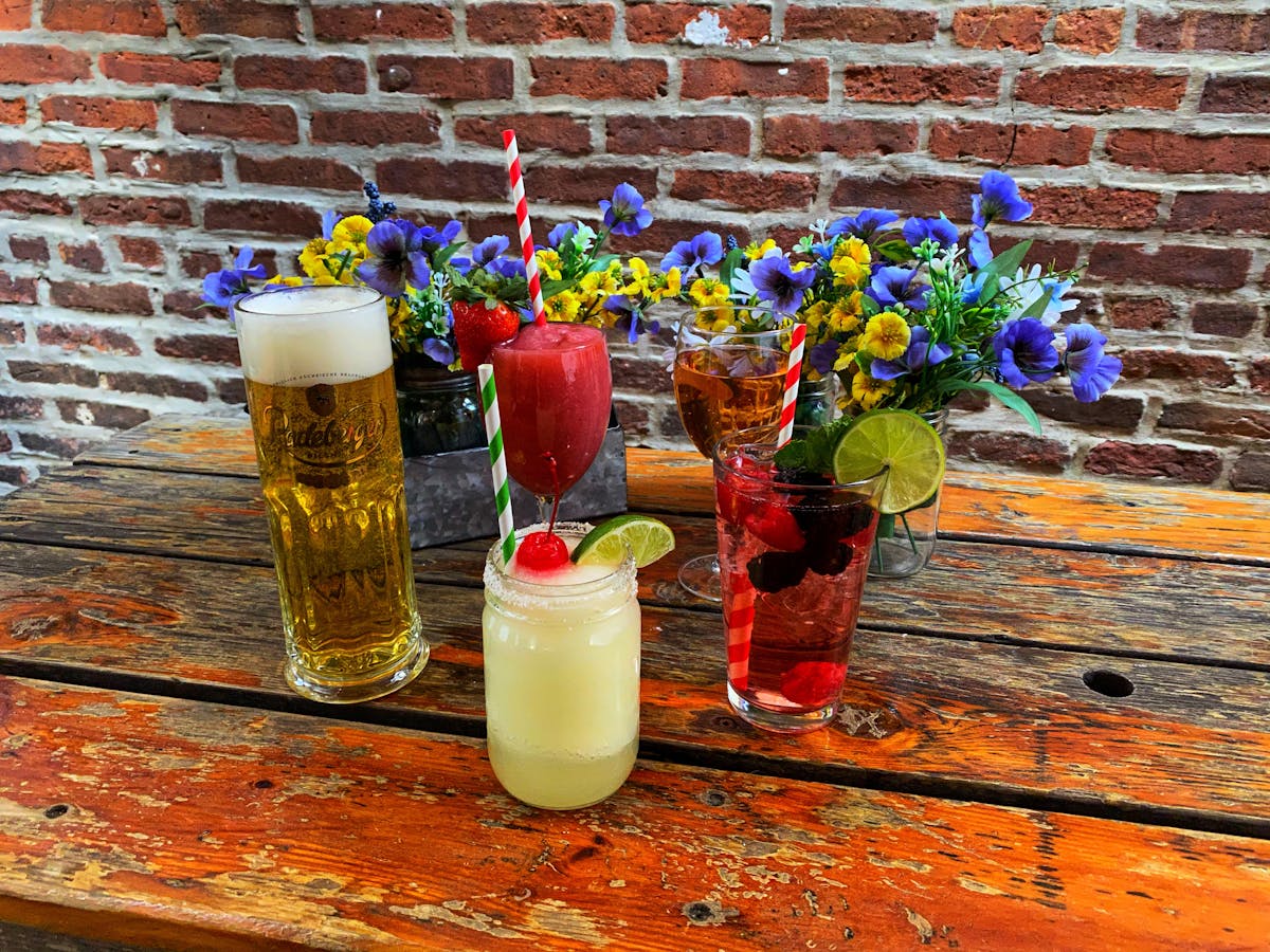 a vase of flowers on a brick building