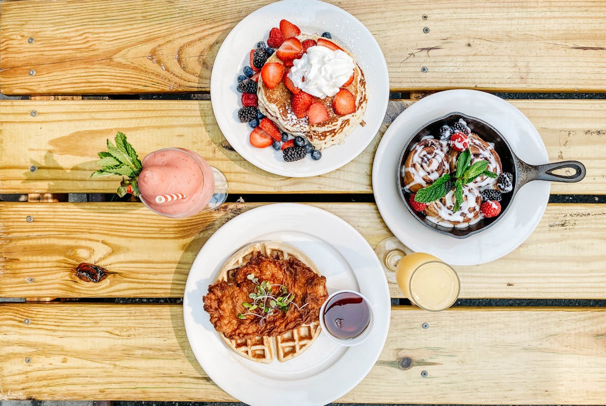 a plate of food on a wooden table