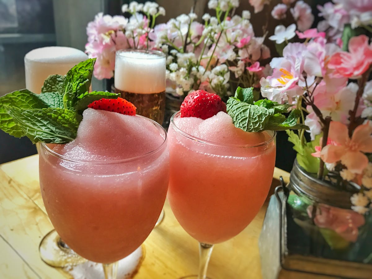 a close up of drinks and flower