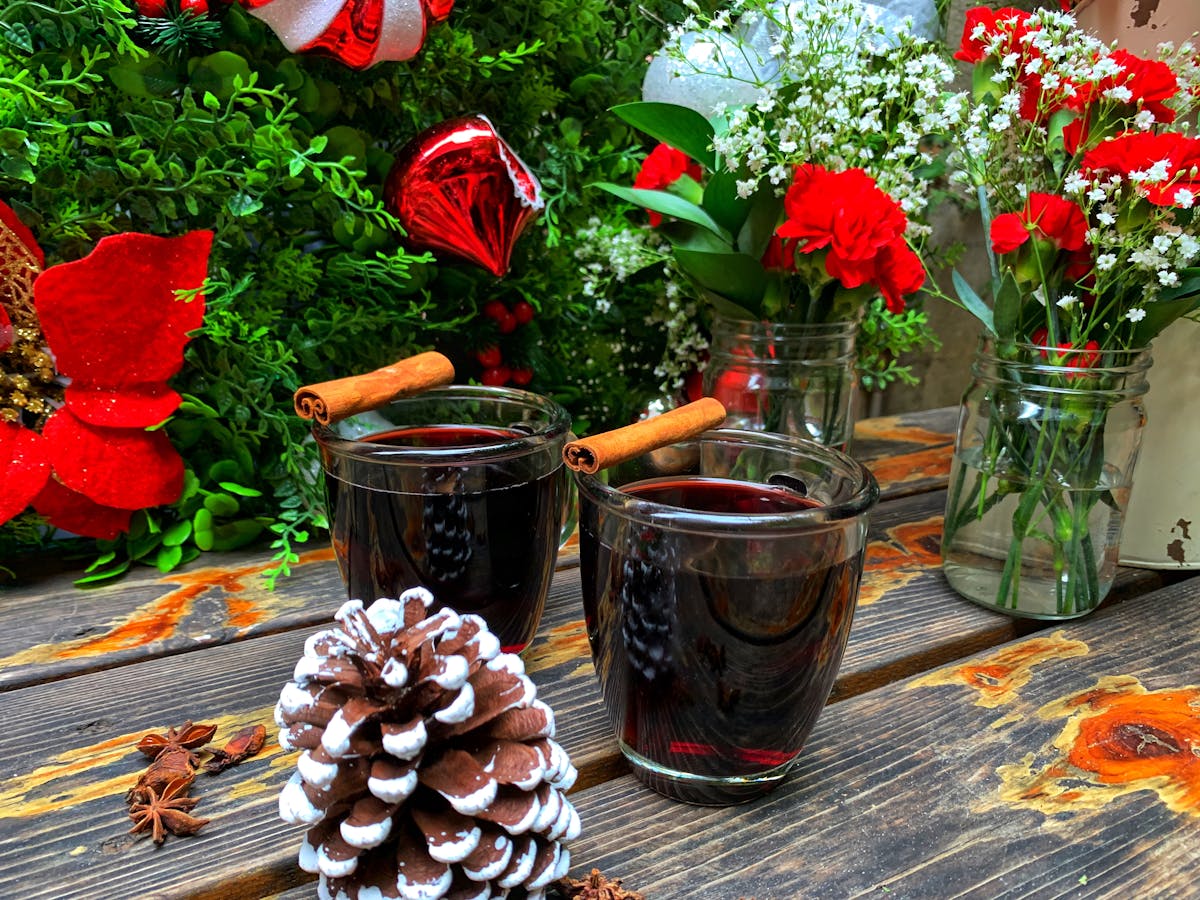 a vase of flowers sits on a picnic table