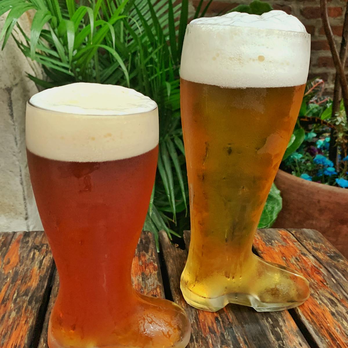 a cup of coffee and a glass of beer on a table