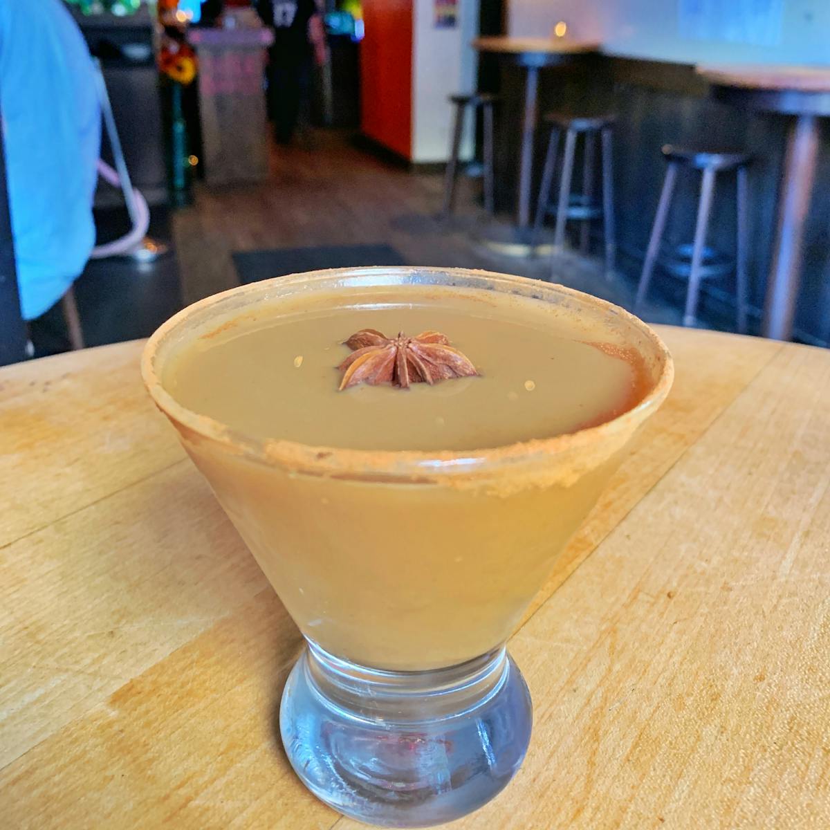 a cup of tea sitting on top of a wooden table