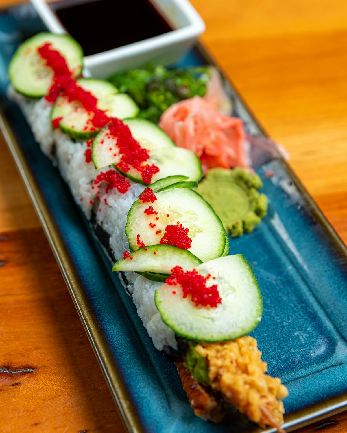 sushi on a wooden tray on a table
