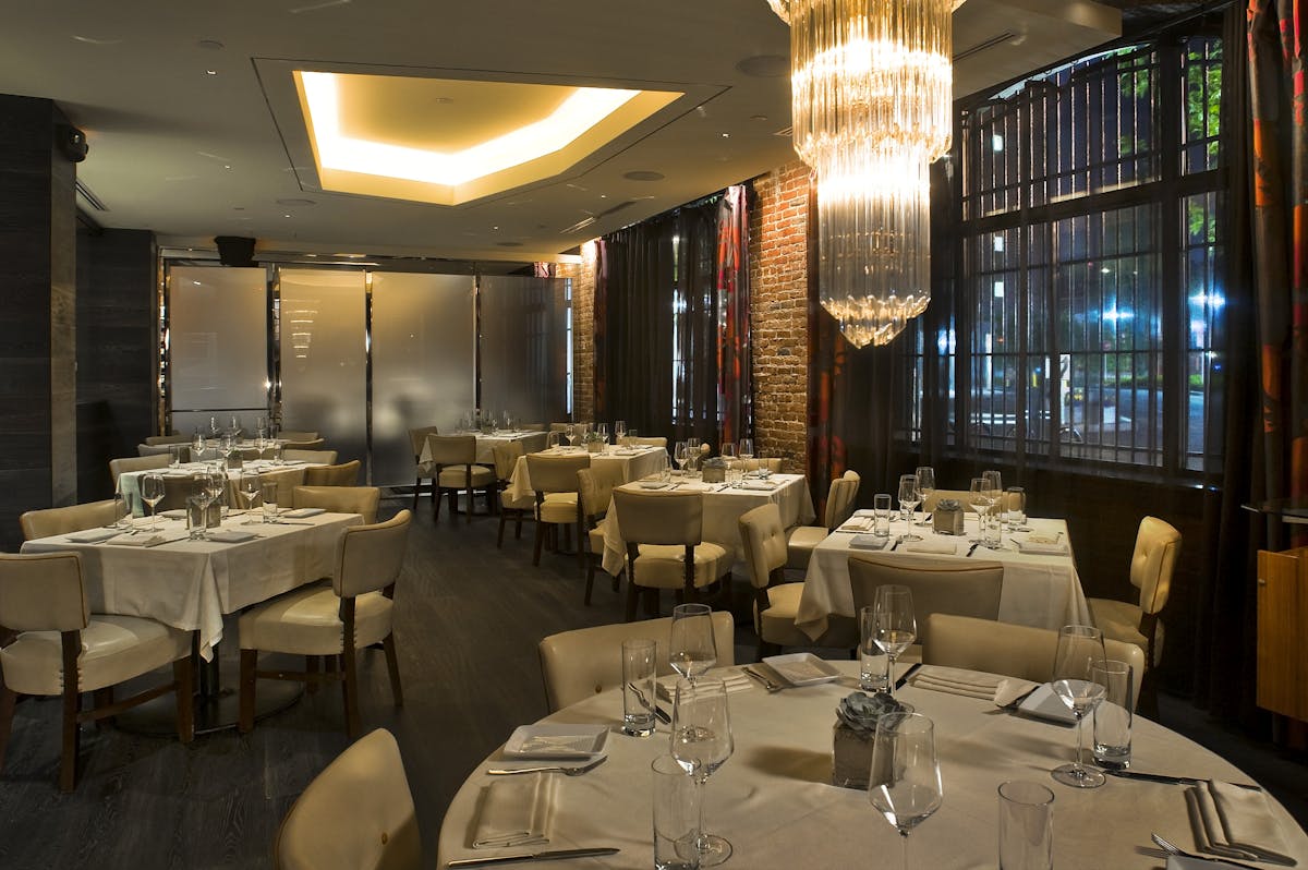 a room filled with furniture and a table in a restaurant