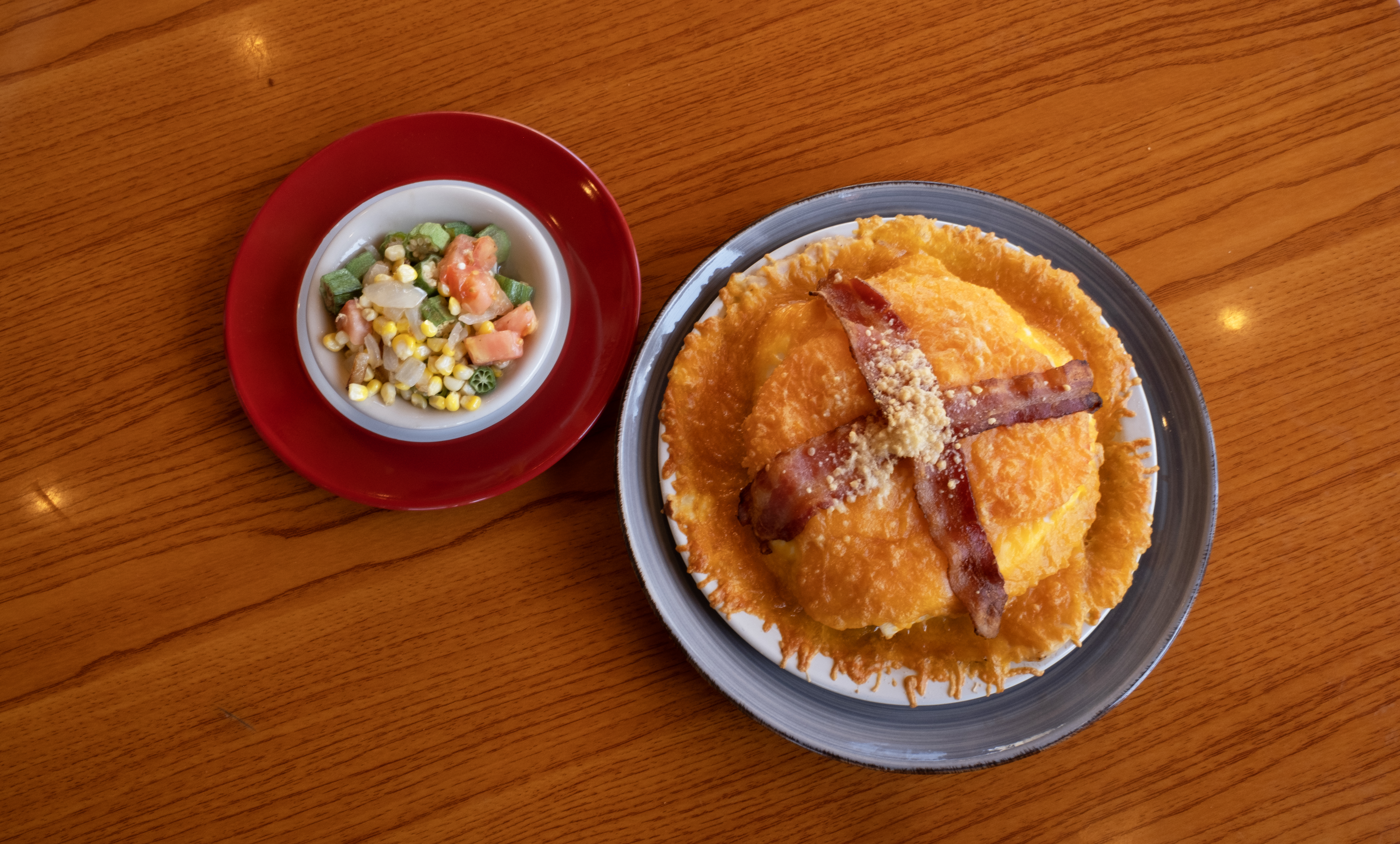 a plate of food sitting on top of a wooden table