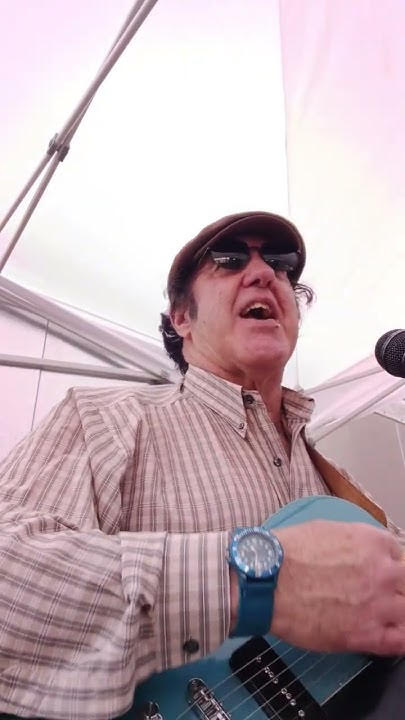 a man wearing sunglasses and a hat