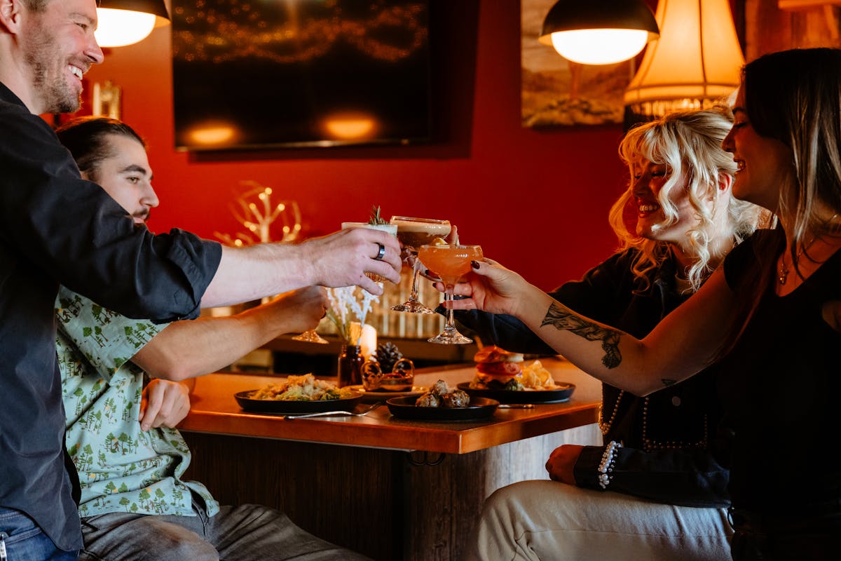 People with cocktails and food