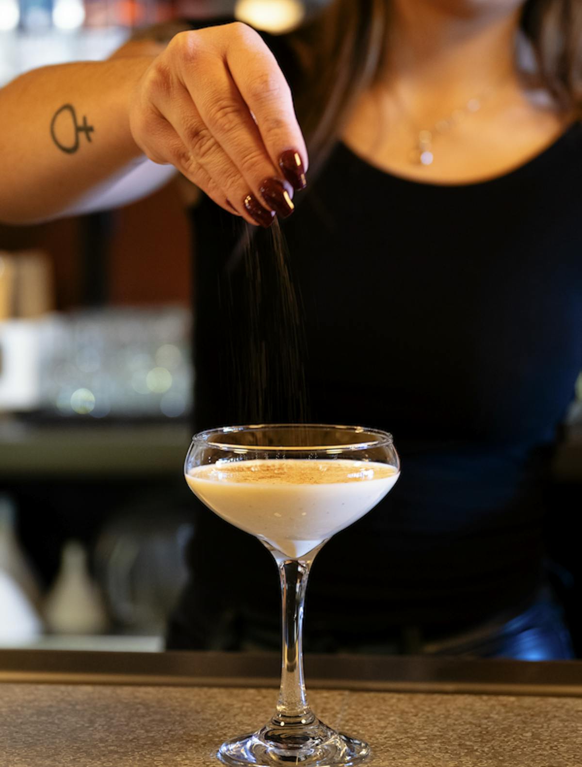 a person holding a wine glass