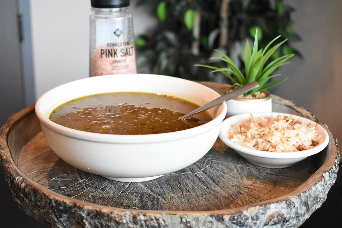 a bowl of soup sitting on a table