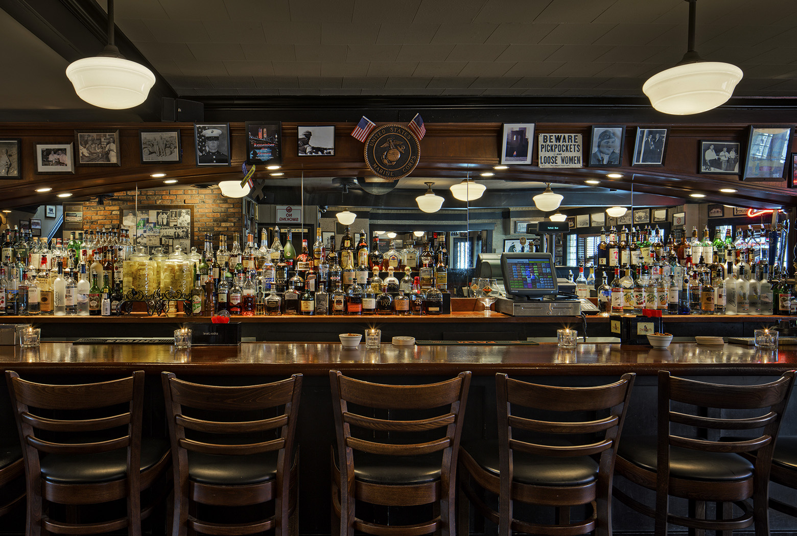 a group of people sitting at a table in a restaurant
