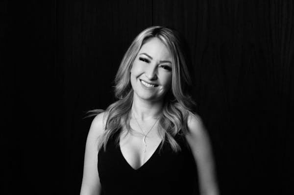 a woman standing in a dark room