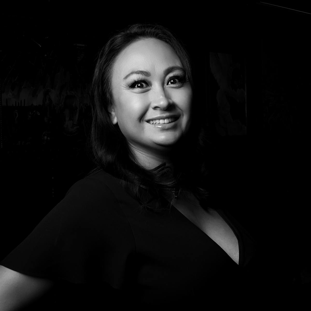 a woman posing in a dark room