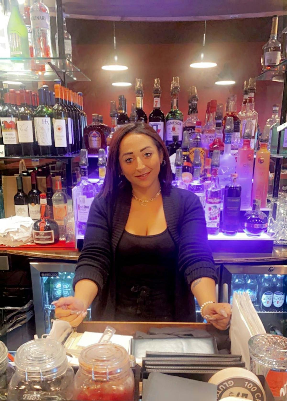 a woman standing in front of a store