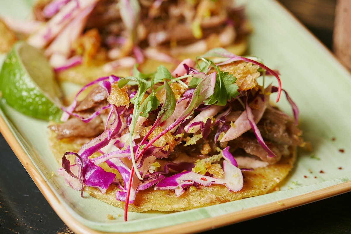 a close up of a plate of tacos